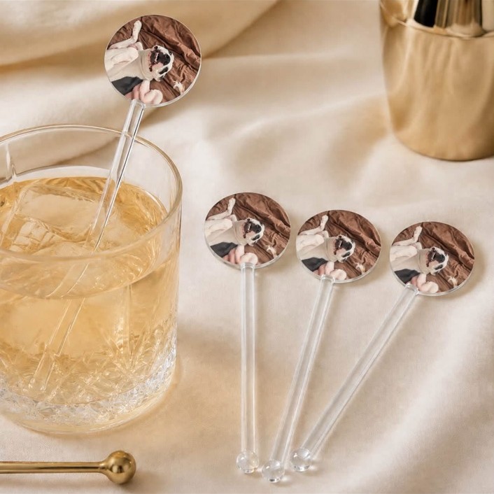 Personalized photo drink stirrers styled in a whiskey glass on ivory silk